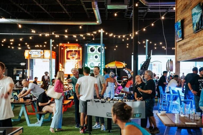 People socializing and playing games at Picklenpins arcade - Picklenpins
