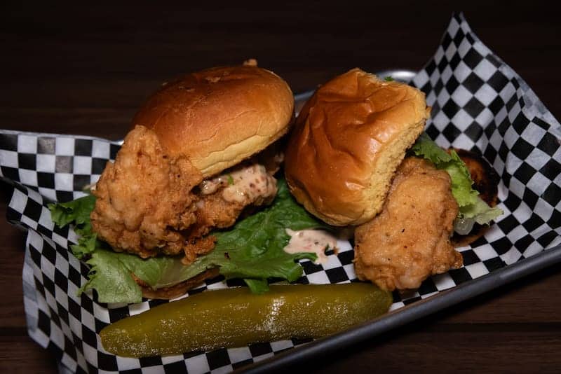 Crispy chicken sandwiches with lettuce and pickle - Picklenpins in NOLA