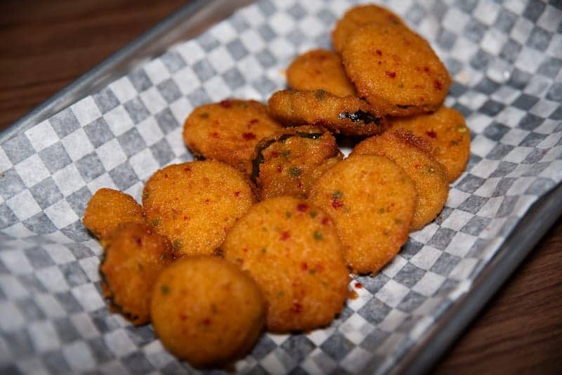 Loaded nachos and fried pickle chips - Picklenpins in NOLA