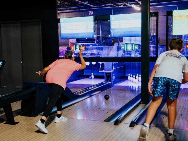 Person bowling, action shot, at Pickle-Pins