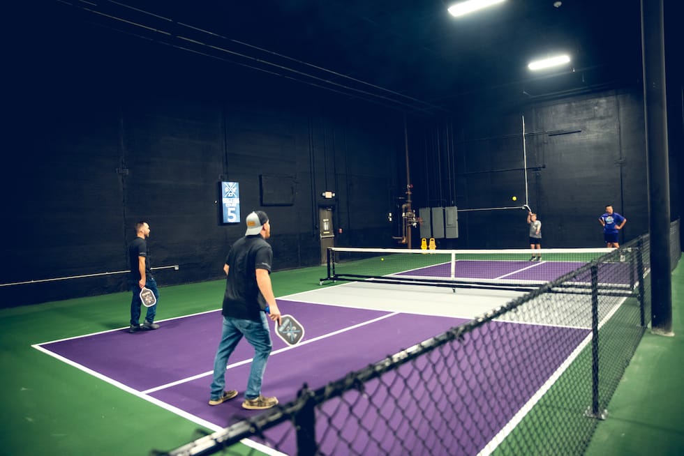 man playing pickleball, serving the ball - Pickle-Pins